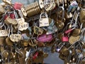 Love padlocks attached along the river Seine in Paris, France