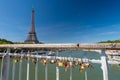 Love padlocks on Debilly Footbridge with Eiffel Tower in the background. Royalty Free Stock Photo