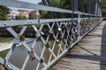 Love padlocks on Elizabeta Bridge railing on Somes River on August 21, 2018 in Cluj-Napoca.