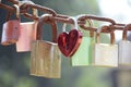 Love padlocks on a rusty chain on a sunny day Royalty Free Stock Photo