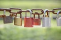 Love padlocks on a rusty chain on a sunny day Royalty Free Stock Photo