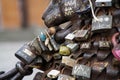 Love padlocks at rusty statue of bronze lion