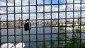 Love padlocks on a wire mesh during a scenic walk in a Stockholm street