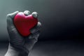 Love and Pain Concept, Hand Squeezing a Red Heart with Anger and Royalty Free Stock Photo