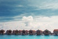 Love on Paradise island, concept. Bungalow on stilts in the water, amazing tropical nature. Maldives resort Royalty Free Stock Photo