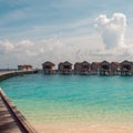 Love on Paradise island, concept. Bungalow on stilts in the water, amazing tropical nature. Maldives resort.