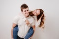 love, passionate and beautiful couple have fun against the white wall. Royalty Free Stock Photo