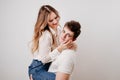 love, passionate and beautiful couple have fun and cuddle against the white wall Royalty Free Stock Photo
