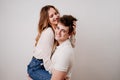 love, passionate and beautiful couple have fun against the white wall. Royalty Free Stock Photo