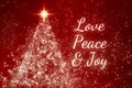Love, peace and joy text on red background with shining star like pine tree. Christmas season concept.