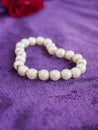 Love, pearls, rose, purple velvet. Royalty Free Stock Photo