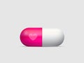 Love pill in pink and white with a heart