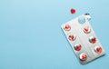 Love pills. Blister pack with red heart shaped pills. Tablets for lovers or potency. Blue background. Copy space for Royalty Free Stock Photo