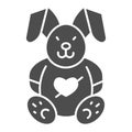 Love plush rabbit with heart solid icon, valentine day concept, toy bunny sign on white background, romantic gift icon Royalty Free Stock Photo