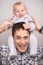 Love, portrait or father and baby with piggyback, playing or bonding at home with shoulder games. Child development Royalty Free Stock Photo