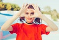 Love. Portrait smiling happy young redhead woman, making heart sign, symbol with hands. Positive human emotion expression feeling Royalty Free Stock Photo