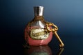 Love potion with chain and golden key around the bottle Royalty Free Stock Photo