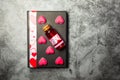 Love potion and heart shaped sweets on a gift box