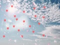 Valentine day red hearts on blue sky fluffy white clouds falling pink petals  background illustration template  copy space Royalty Free Stock Photo