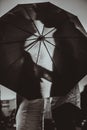 Love in the rain / Silhouette of kissing couple under umbrella Royalty Free Stock Photo