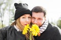 Love, relationship, family and people concept - couple with bouquet of gerberas in autumn park Royalty Free Stock Photo