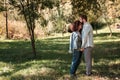 Love, relationship, family and people concept - smiling couple hugging in autumn park Royalty Free Stock Photo