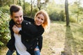 love, relationship, family and people concept - smiling couple having fun in autumn park. Royalty Free Stock Photo