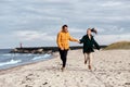 couple running along autumn beach Royalty Free Stock Photo