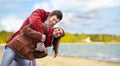 Happy couple having fun over autumn beach Royalty Free Stock Photo