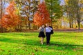 love, relationships, season and people concept happy young couple hugging in autumn park Royalty Free Stock Photo