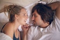 Love, relax and couple in a bed talking, bonding and resting in their home from above. Wake up, conversation and people Royalty Free Stock Photo