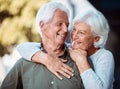 Love, romance and dating with a senior couple hugging outdoor in nature together during retirement. Relax, park and Royalty Free Stock Photo