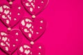 Love, romance, Valentines Day concept, toned felt fabric hearts design on contrasting hot pink background, ample copy space Royalty Free Stock Photo