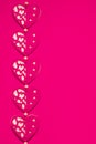 Love, romance, Valentines Day concept, toned felt fabric hearts design on contrasting hot pink background, ample copy space Royalty Free Stock Photo