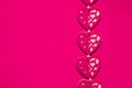 Love, romance, Valentines Day concept, toned felt fabric hearts design on contrasting hot pink background, ample copy space Royalty Free Stock Photo