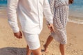 Love - romantic couple holding hands on a beach in sunset Royalty Free Stock Photo