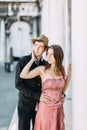 Love - romantic couple in Venice on Piazza San Marco. Young couple on travel vacation holidays hugging and embracing having fun on Royalty Free Stock Photo