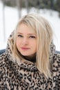 Love romantic winter photoshoot. Blonde beautiful pretty Caucasian European woman, girl in stylish clothes,fur leopard