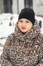 Love romantic winter photoshoot. Blonde beautiful pretty Caucasian European woman, girl in stylish clothes,fur leopard