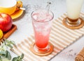 Love Sakura Sparkling Water in glass with ice cubes on mat and white background. fresh Healthy drinks concept Royalty Free Stock Photo