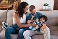 We love seeing him happy. a young boy being tickled by his parents. Royalty Free Stock Photo