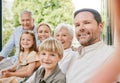 Love, selfie and a big family on a sofa in the living room of their home together during a visit. Portrait, photograph Royalty Free Stock Photo