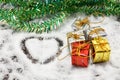 Love shape, gifts box, tree on snow background.