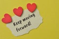 Love shapes and torn paper written with text KEEP MOVING FORWARD Royalty Free Stock Photo