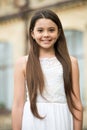Love the shine. Beauty look of child girl. Happy child smile outdoors. Little child with long hair in casual wear