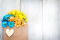 Love shopping abstract background with paper bag and spring flowers Royalty Free Stock Photo