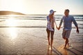 Love should always be your first priority. a mature couple spending the day at the beach.