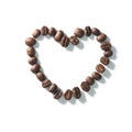 Love sign with coffee beans arranged Heart shape over white background Royalty Free Stock Photo