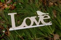 Love sign inscription on grass in park