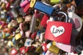 Love sign and romance concept. Heart shaped, love padlocks locked at landmark, tourists place